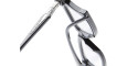 Close-up of Kuboraum D75 black eyeglasses with clear lenses, highlighting the hinge area and silver decorative detail on the temple against a white background.