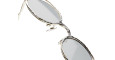 Close-up of Kuboraum H11 round sunglasses with silver metal frames and light-tinted lenses, angled on a white background.