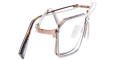 The Kuboraum H15 features a unique double-layered metal frame in rose gold and silver, rectangular lenses, and tortoiseshell-patterned arms for a stylish eyewear look.