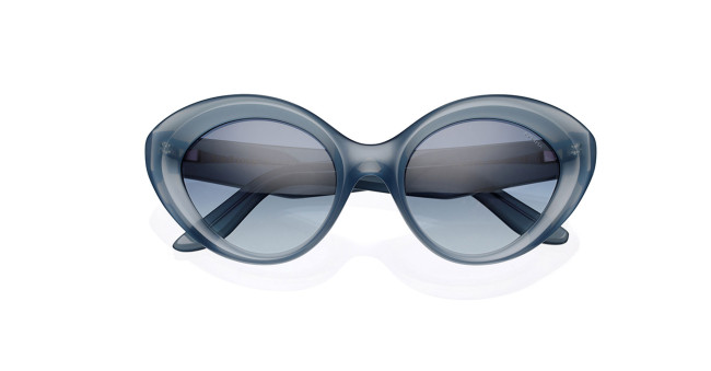 Lapima Julia oversized oval sunglasses with thick blue frames and dark tinted lenses, shown on a white background.