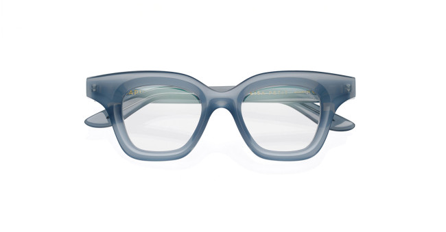 The Lapima Lisa Petit 44 features translucent blue rectangular eyeglasses with thick, bold frames and clear prescription lenses, displayed facing forward on a white background.