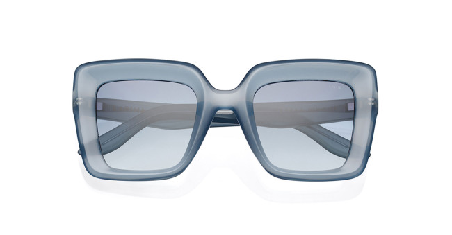 Rectangular, oversized sunglasses with thick, translucent blue frames and matching blue-tinted lenses, shown from the front on a white background.