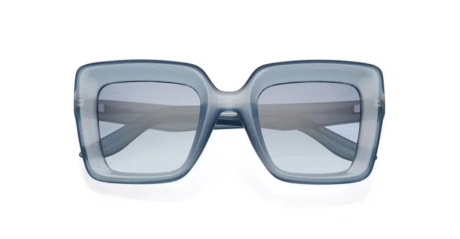Rectangular, oversized sunglasses with thick, translucent blue frames and matching blue-tinted lenses, shown from the front on a white background.
