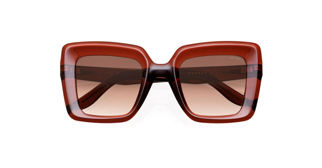 A pair of oversized, square-shaped sunglasses with a glossy, dark red frame and gradient brown-tinted lenses, displayed against a white background.