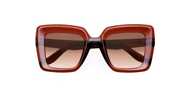 A pair of oversized, square-shaped sunglasses with a glossy, dark red frame and gradient brown-tinted lenses, displayed against a white background.