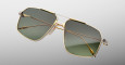 The Jacques Marie Mage Jagger sunglasses feature stylish aviator gold metal frames and green-tinted lenses, showcased on a plain light gray background.