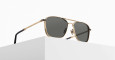 The Matsuda M3135 gold-framed aviator sunglasses with dark lenses rest on a white geometric surface against a plain, light background.