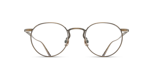 Front view of Matsuda M3140 round eyeglasses featuring thin, metallic bronze frames and clear lenses, set against a plain white background.