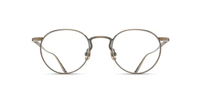 Front view of Matsuda M3140 round eyeglasses featuring thin, metallic bronze frames and clear lenses, set against a plain white background.