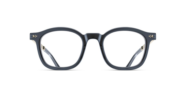 Front view of Matsuda M2068 black round eyeglasses with thick frames and clear lenses, featuring small decorative metal accents at the upper corners, set against a white background.