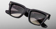 A close-up of the Jacques Marie Mage Torrance black rectangular sunglasses featuring thick frames and dark tinted lenses, displayed on a plain light gray background.